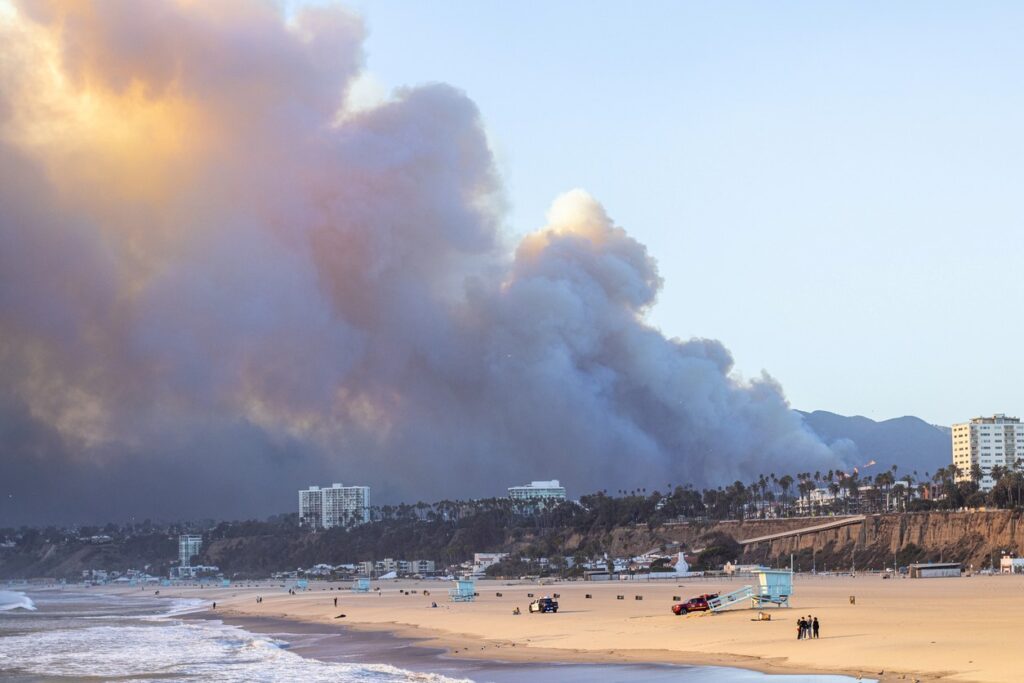 The Pacific Palisades fire burns near Los Angeles, California, with huge plumes of smoke seen from Santa Monica Beach.